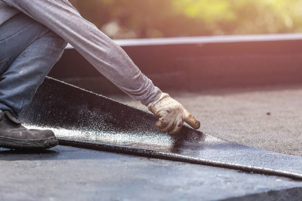Professional Waterproofing technician working in Butlerville, IN